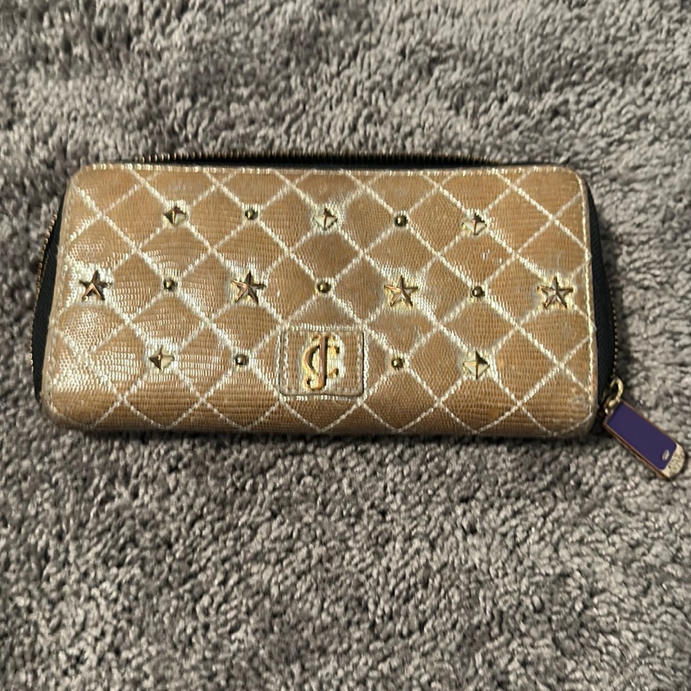 Gold juicy couture wallet. Pre loved. 100 percent Goat leather material